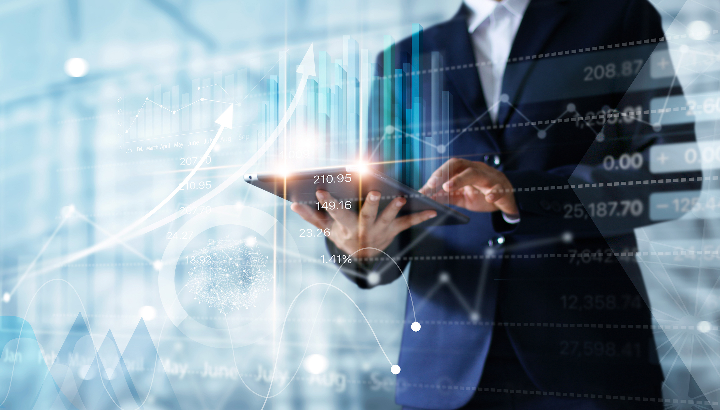 A business man using a tablet to make analysis